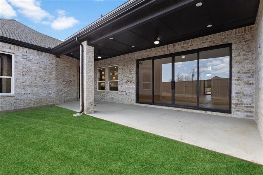 Exterior details and patio area of a home in , Denison (Image 3).