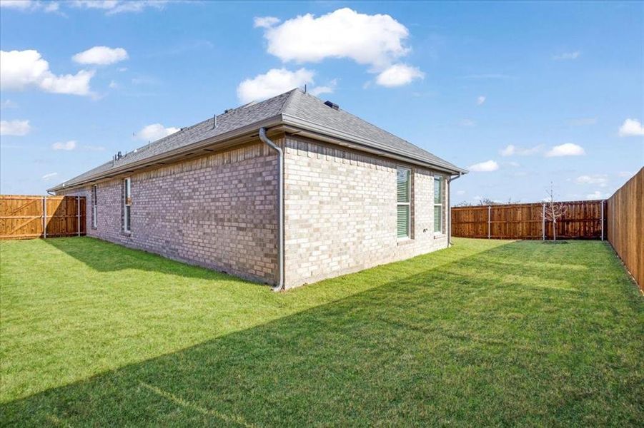Exterior details and patio area of a home in The Preserve At Country Ridge, Sherman (Image 19).