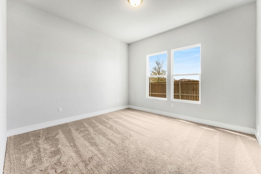 A well-lit, open bedroom awaits your personal touch with ample natural light. A well-lit, open bedroom awaits your personal touch with ample natural light.