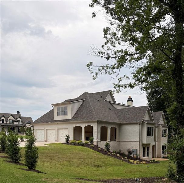 Front exterior of a new home in , Flowery Branch, GA, highlighting curb appeal (Image 5).