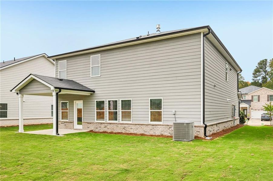 Exterior details and patio area of a home in Westmont Preserve, Powder Springs (Image 33).