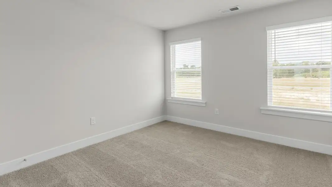 Spacious, unfurnished interior of a new home in The Highlands at Cedar Hill Landing, Navassa (Image 27).