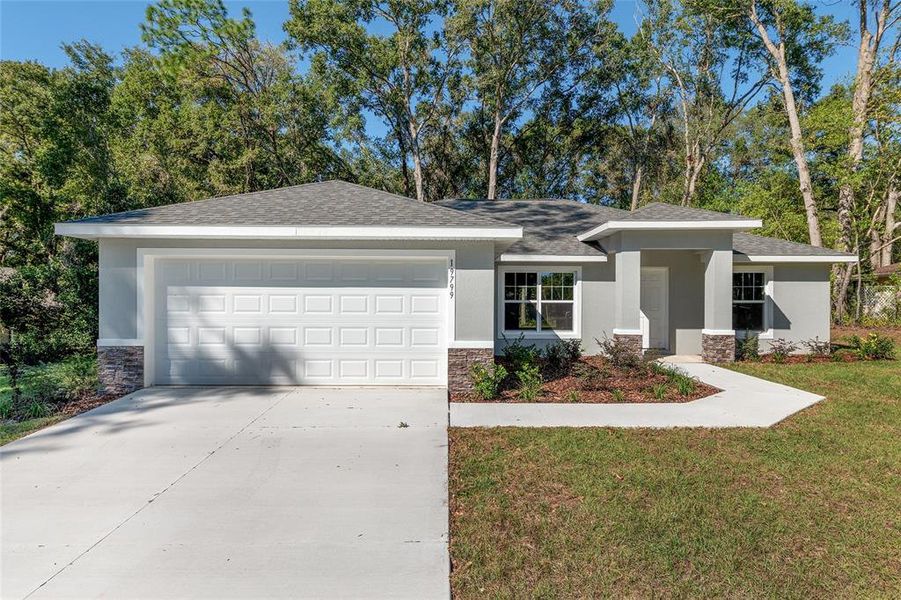 Front exterior of a new home in , Dunnellon, FL, highlighting curb appeal (Image 23).