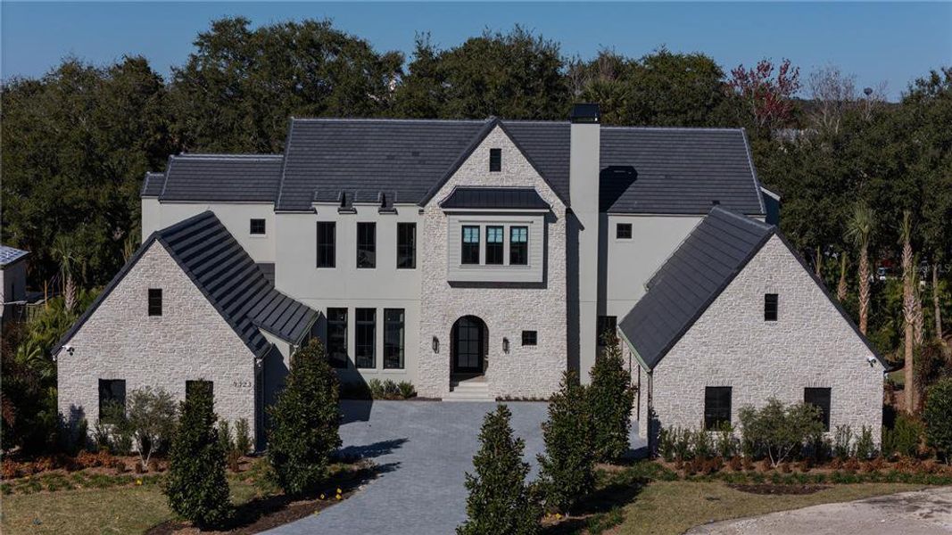 Front exterior of a new home in , Windermere, FL, highlighting curb appeal (Image 20).