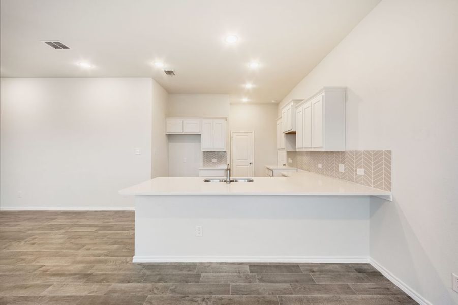 Representative exterior photo of a completed home built from the Joliet by Impression Homes in Heartland, Heartland, TX (Image 6).