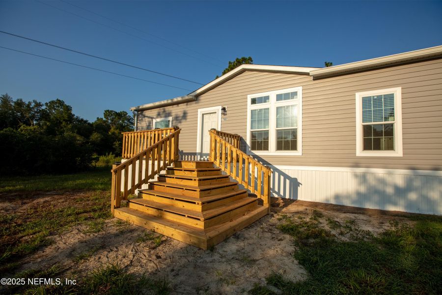 Front exterior of a new home in , Keystone Heights, FL, highlighting curb appeal (Image 31). Front exterior of a new home in , Keystone Heights, FL, highlighting curb appeal (Image 31).