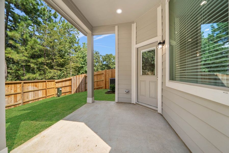 Exterior details and patio area of a home in Woodforest, Montgomery (Image 23).