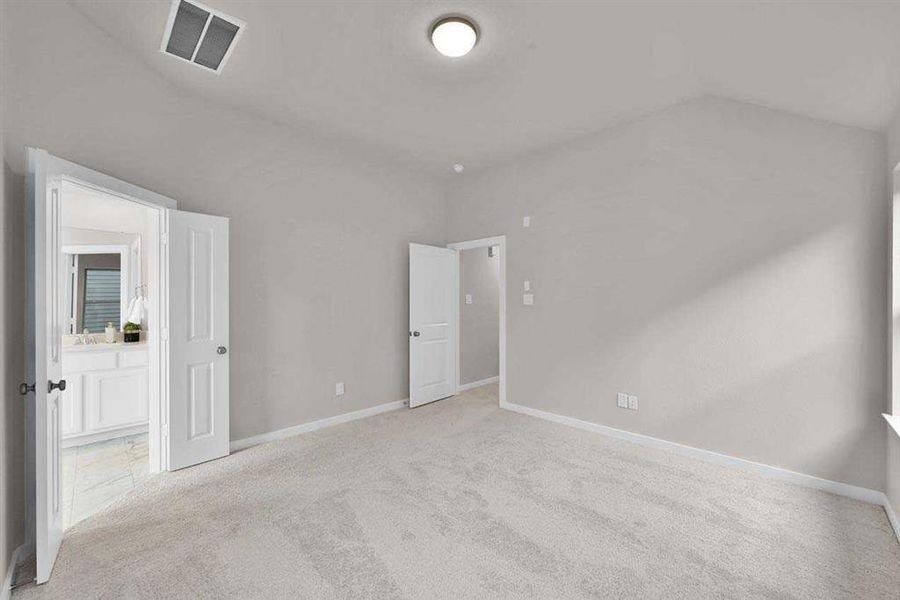 Generous retreat with vaulted ceilings and natural light. (Original Builder Staged Photo 2024)