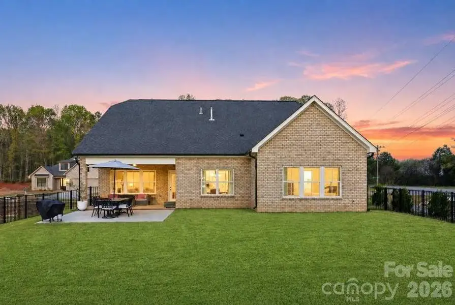 Beautiful backyard setting at sunset, plenty of space to relax or entertain.