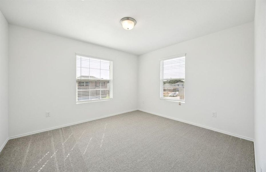 Roomy secondary bedroom with extensive closet storage Roomy secondary bedroom with extensive closet storage