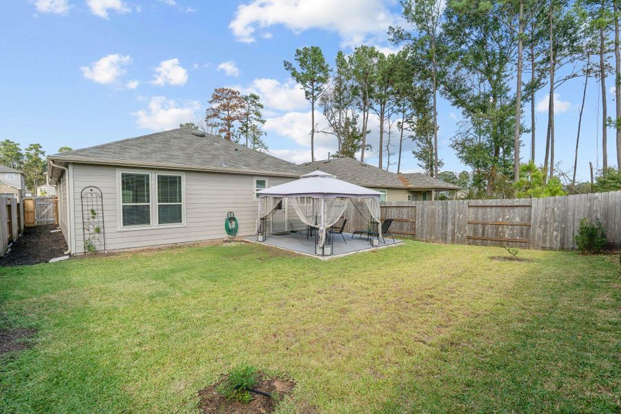 Exterior details and patio area of a home in The Pines At Seven Coves, Willis (Image 20). Exterior details and patio area of a home in The Pines At Seven Coves, Willis (Image 20).