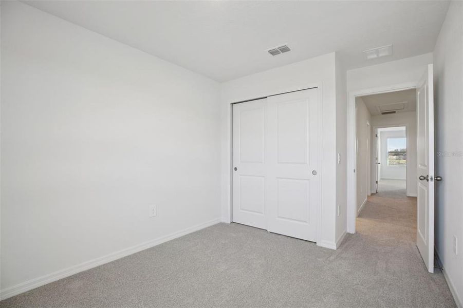 Spacious, unfurnished interior of a new home in The Reserve at Hammock Oaks Townes, Lady Lake (Image 41).