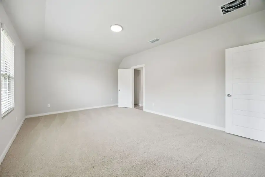Primary Suite in the Hayden home plan by Trophy Signature Homes – REPRESENTATIVE PHOTO
