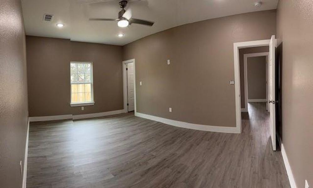 Unfurnished room featuring visible vents, ceiling fan, baseboards, recessed lighting, and wood finished floors