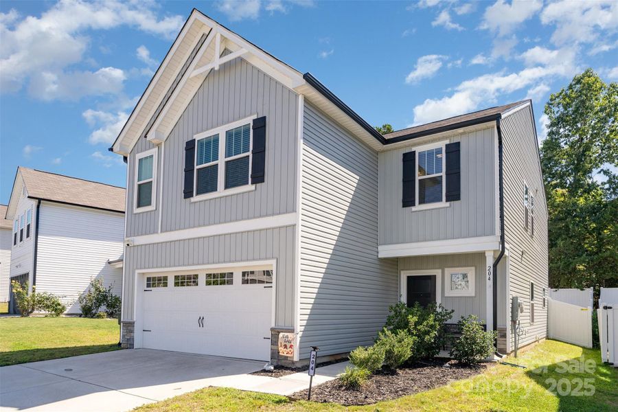 Front exterior of a new home in Shay Crossing, Salisbury, NC, highlighting curb appeal (Image 16). Front exterior of a new home in Shay Crossing, Salisbury, NC, highlighting curb appeal (Image 16).