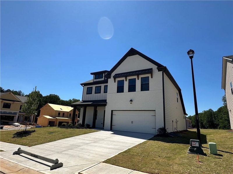 Front exterior of a new home in Summerlin, Winder, GA, highlighting curb appeal (Image 15).