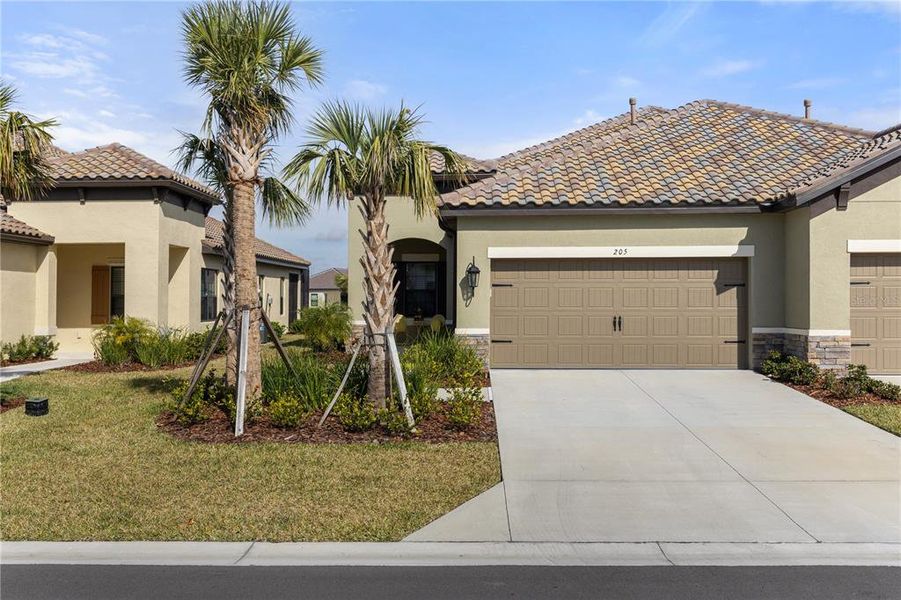 Front exterior of a new home in , Nokomis, FL, highlighting curb appeal (Image 2).