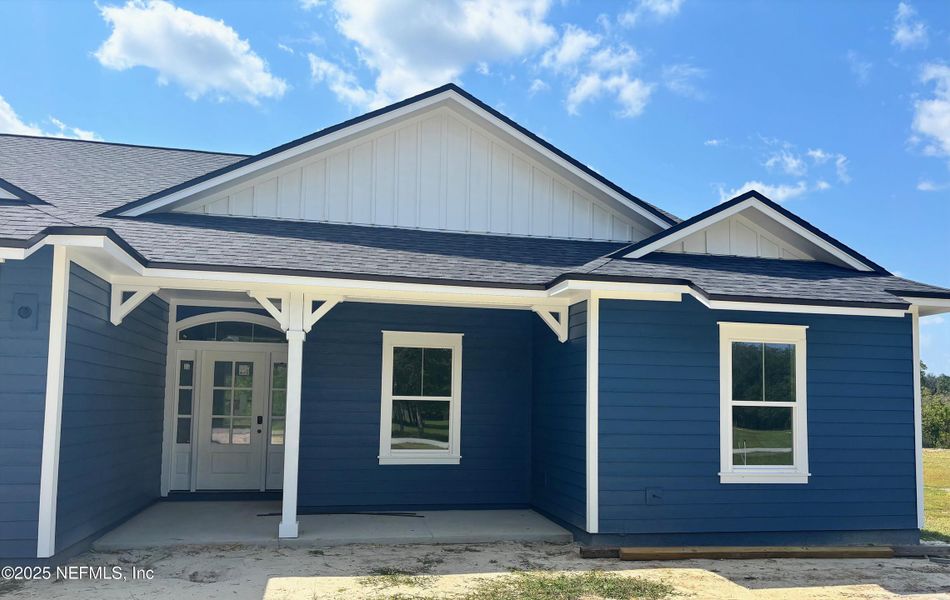 Front exterior of a new home in , Melrose, FL, highlighting curb appeal (Image 12).