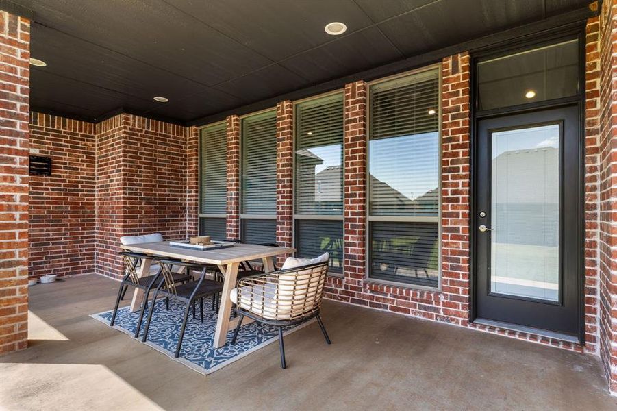 View of patio featuring outdoor dining space View of patio featuring outdoor dining space