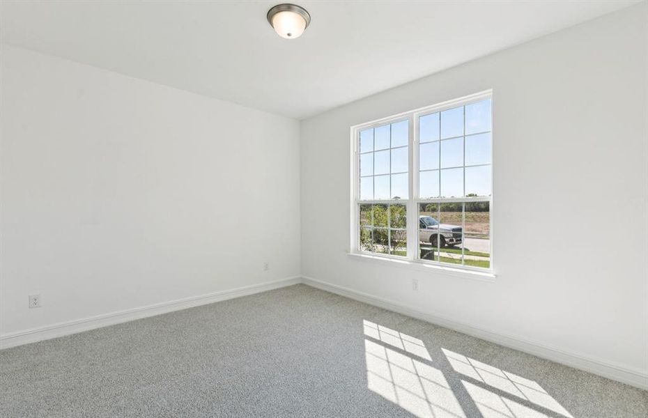 Spacious secondary bedroom with large windows