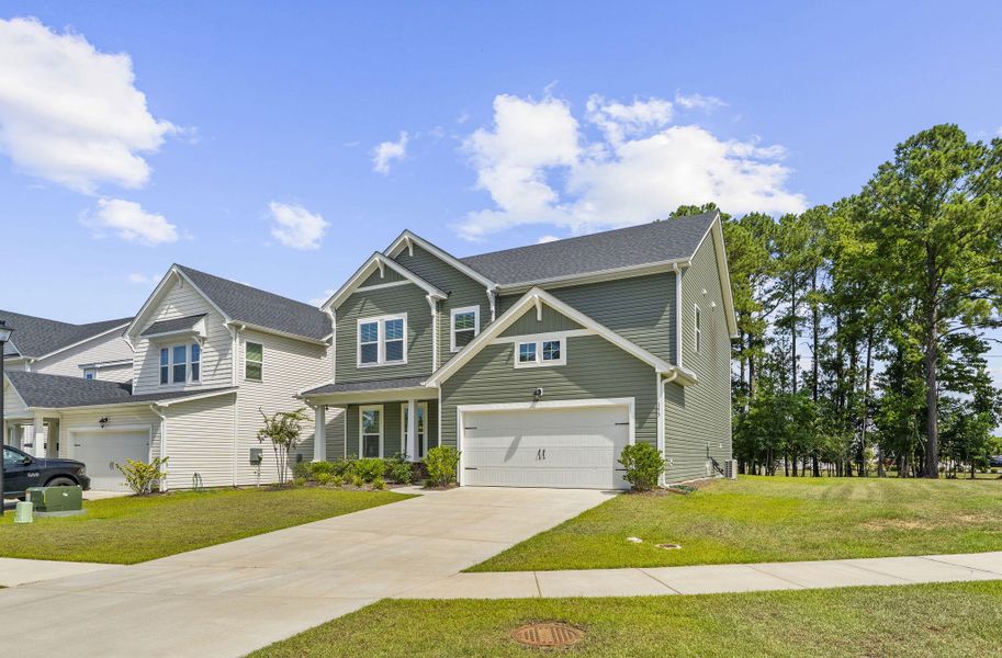 Front exterior of a new home in The Groves of Berkeley, Moncks Corner, SC, highlighting curb appeal (Image 23).