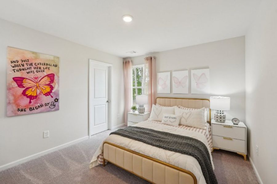 A bedroom with a bed and a lamp. A bedroom with a bed and a lamp.