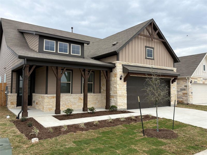 Front exterior of a new home in Willow Springs, Buda, TX, highlighting curb appeal (Image 16).