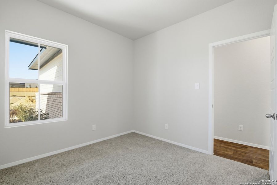 Spacious, unfurnished interior of a new home in Hunters Ranch, San Antonio (Image 18).