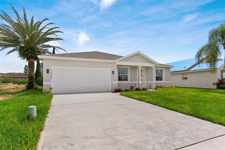 Front exterior of a new home in , Kissimmee, FL, highlighting curb appeal (Image 36).