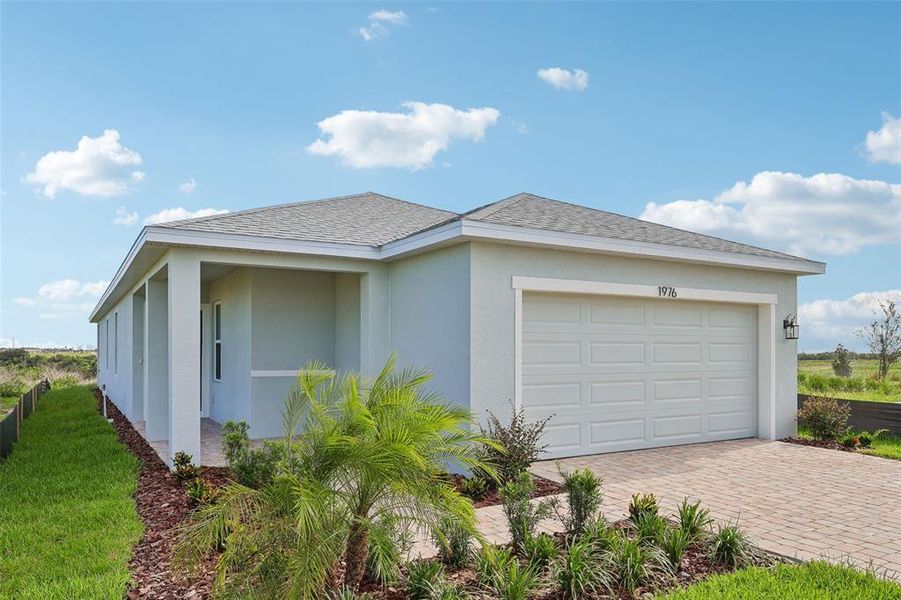 Front exterior of a new home in Hamilton Bluff, Haines City, FL, highlighting curb appeal (Image 22).