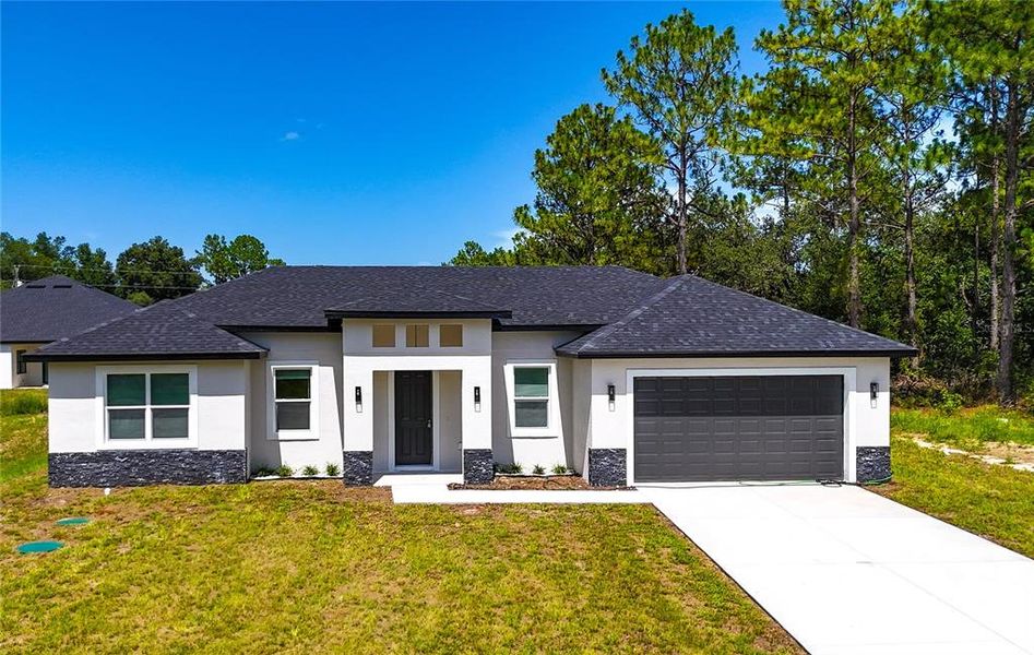 Front exterior of a new home in , Ocala, FL, highlighting curb appeal (Image 22).