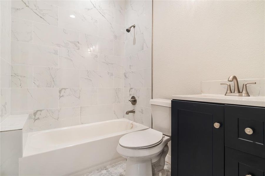 This full bath comes with white subway tile throughout and granite countertops. Vanity and countertops are customizable! Call to ask about upgrades!