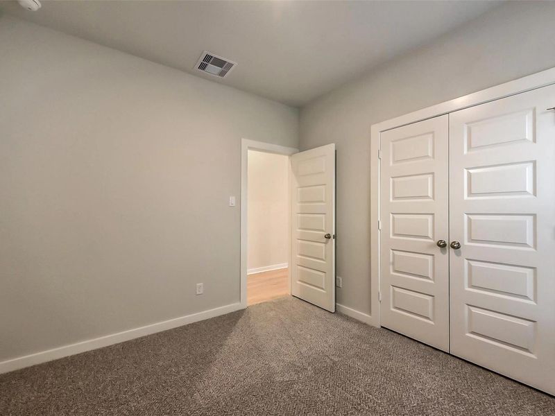 Spacious, unfurnished interior of a new home in Sunterra, Katy (Image 27).