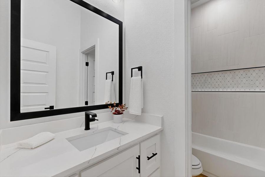 Full bathroom featuring vanity and bathtub / shower combination