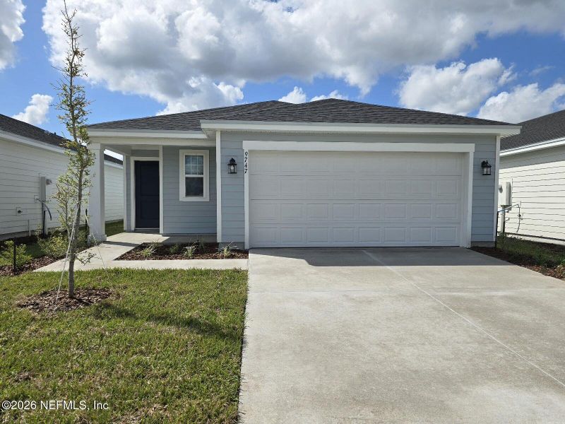 Front exterior of a new home in Cypress Meadows - Classic Series, Jacksonville, FL, highlighting curb appeal (Image 11).