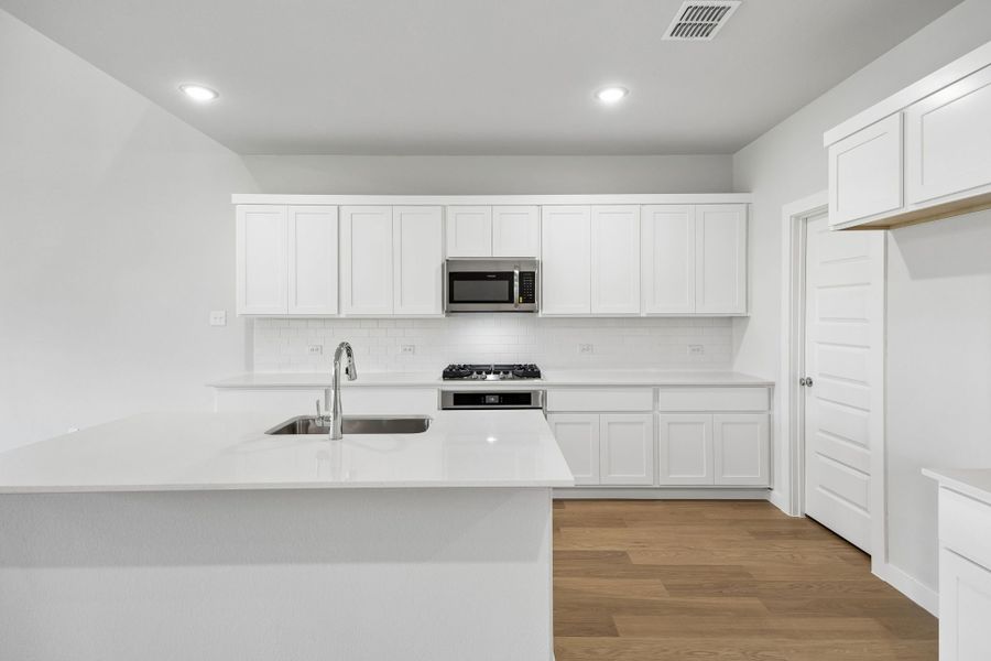 Kitchen in the Winters home plan by Trophy Signature Homes – REPRESENTATIVE PHOTO