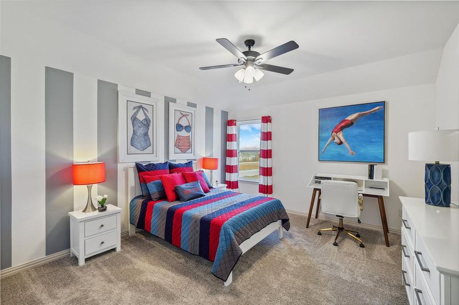 Carpeted bedroom with ceiling fan