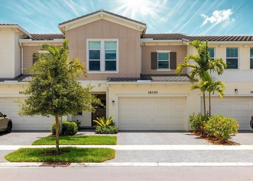 Front exterior of a new home in , Westlake, FL, highlighting curb appeal (Image 19).
