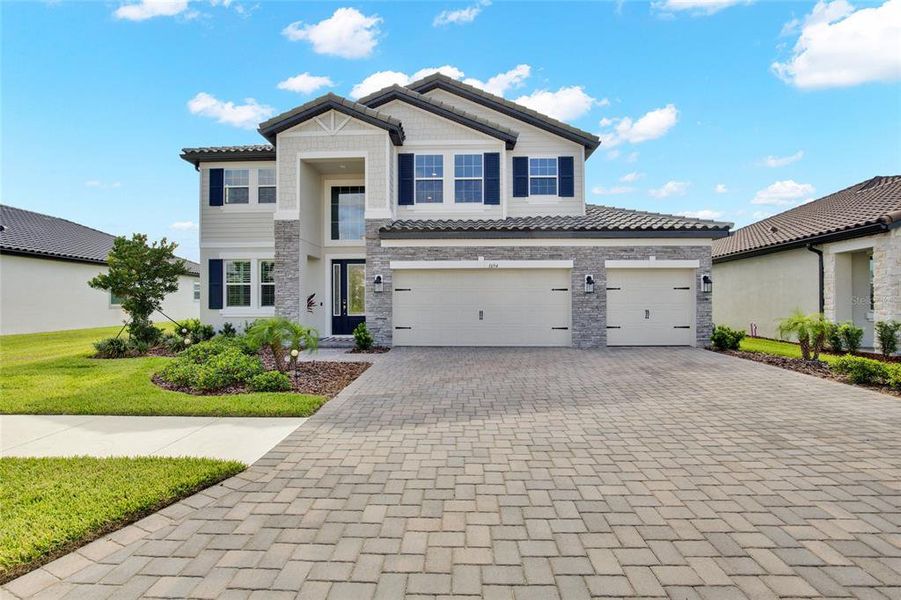 Front exterior of a new home in , Wesley Chapel, FL, highlighting curb appeal (Image 28).