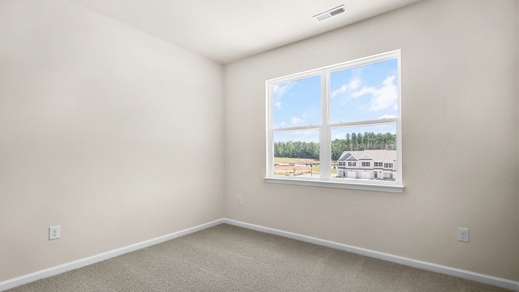 Spacious, unfurnished interior of a new home in The Townes at Madden West, Fuquay Varina (Image 20).