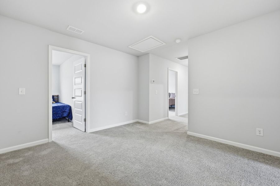 Spacious, unfurnished interior of a new home in Sweetgrass at Summers Corner: Carolina Collection, Summerville (Image 28).