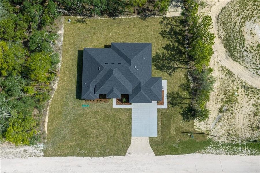 Front exterior of a new home in , Weeki Wachee, FL, highlighting curb appeal (Image 36). Front exterior of a new home in , Weeki Wachee, FL, highlighting curb appeal (Image 36).