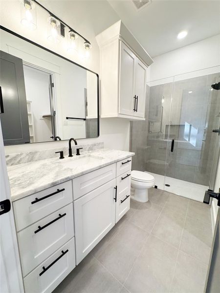 Bedroom 3 Private Bathroom Features Walk In Shower and Designer Tile