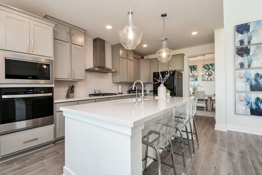 Whether it's a casual everyday suppertime meal or a special day feast, you've got it covered in this magical kitchen, with direct access to formal dining, straight ahead. And, if extra seating is needed, some comfy stools are waiting just under the striking recessed island counter. Whether it's a casual everyday suppertime meal or a special day feast, you've got it covered in this magical kitchen, with direct access to formal dining, straight ahead. And, if extra seating is needed, some comfy stools are waiting just under the striking recessed island counter.