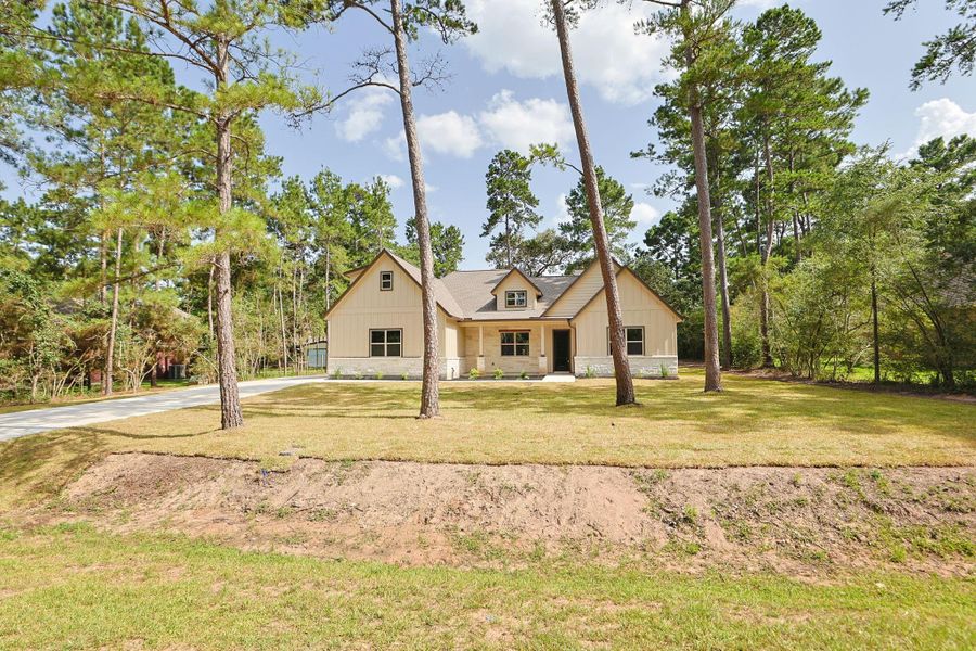 Front exterior of a new home in , Magnolia, TX, highlighting curb appeal (Image 23).