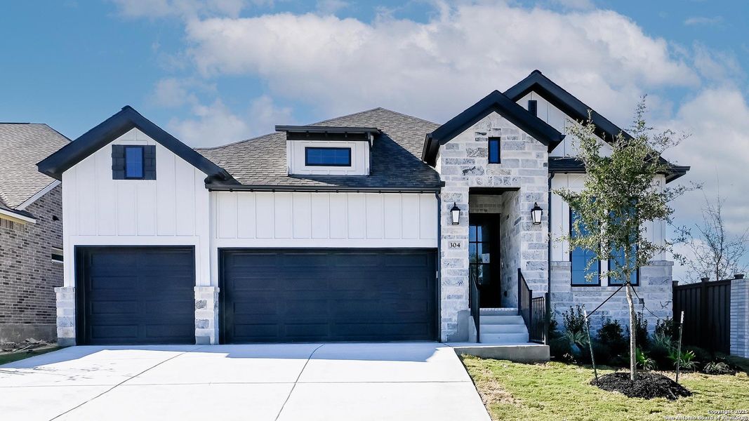 Front exterior of a new home in Mayfair 50', New Braunfels, TX, highlighting curb appeal (Image 2).