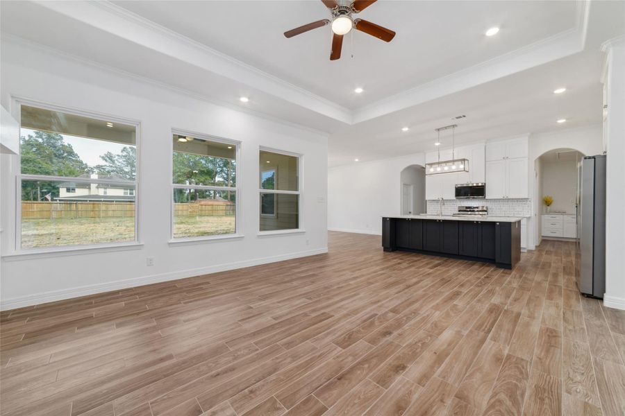 Living room space opens to kitchen making it perfect for entertaining. Living room space opens to kitchen making it perfect for entertaining.