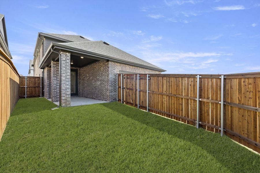Exterior details and patio area of a home in Hillside Village 40s, Celina (Image 20).
