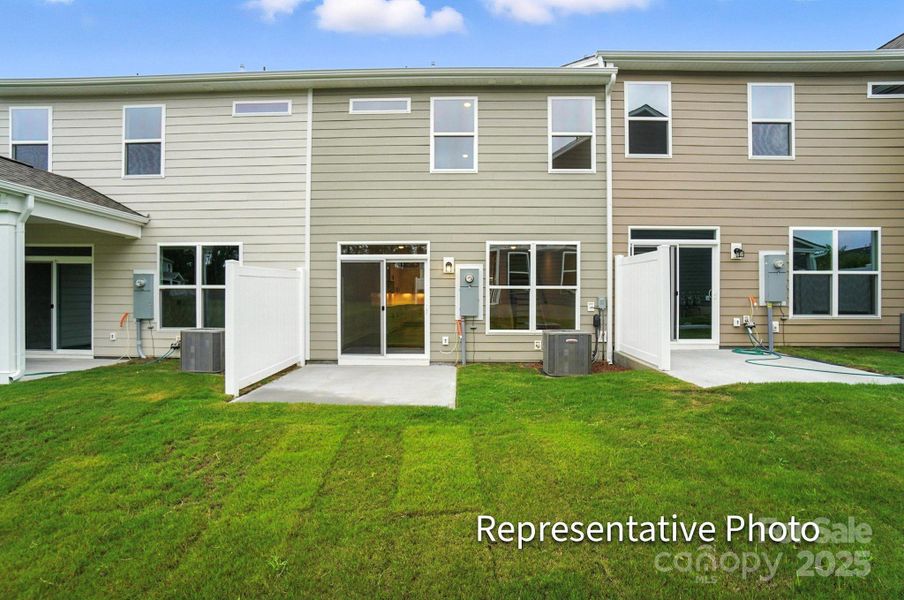 Exterior details and patio area of a home in Harrisburg Village Townhomes, Harrisburg (Image 2).