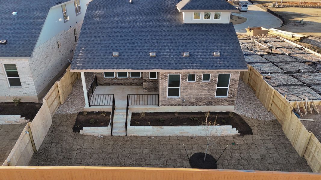 Front exterior of a new home in The Grove at Blackhawk, Pflugerville, TX, highlighting curb appeal (Image 27). Front exterior of a new home in The Grove at Blackhawk, Pflugerville, TX, highlighting curb appeal (Image 27).